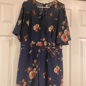 Lila Rose Romper with pockets slightly sheer.